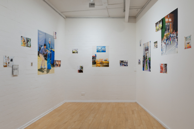 pictures on a the walls in a gallery space