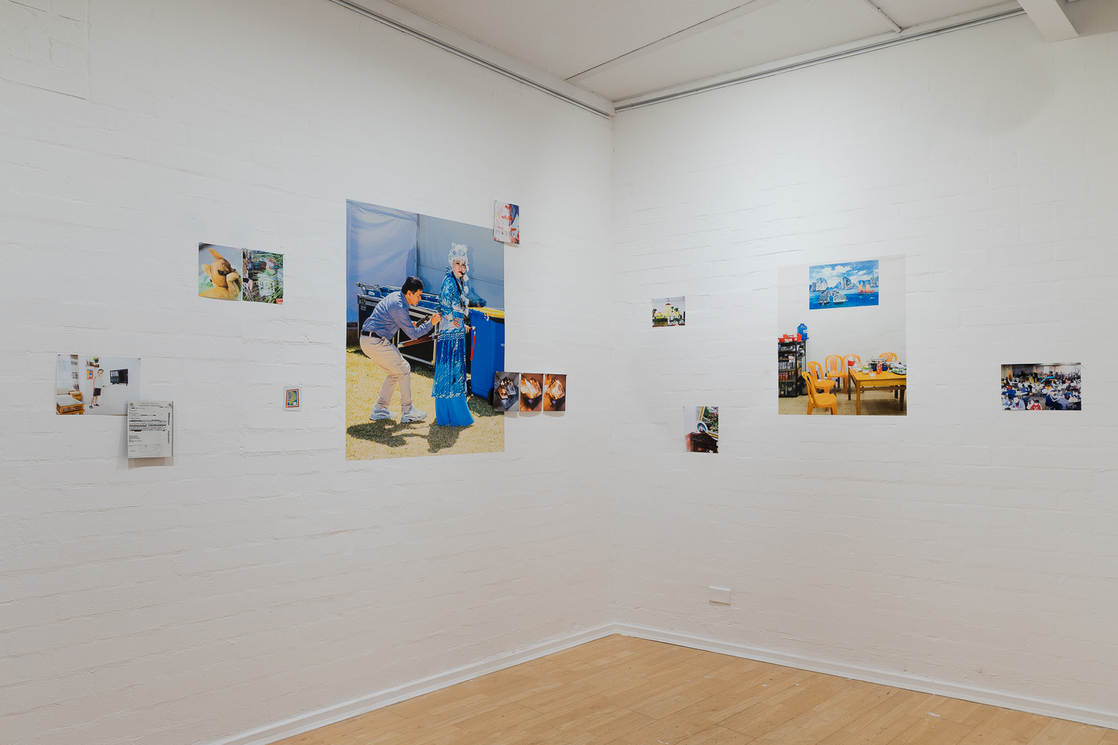 pictures on a the walls in a gallery space